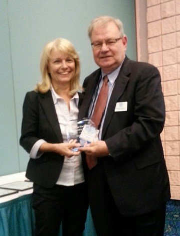 Professor Atara Sivan (left) receives the award from Professor Christopher Edginton, Secretary General of World Leisure Organization.