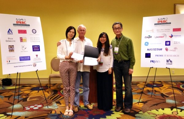 Dr Regina Chen (left) and Dr Flora Hung-Baesecke (second from right) receive the award from Professor Don Stacks, IPRRC Executive Director (second from left) and Dr Koichi Yamamura, Award Sponsor (right)