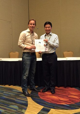 Dr Timothy Fung (right) receives the "Top Three Faculty Papers" award at the Annual Conference of the Association for Education in Journalism and Mass Communication, Communication Theory and Methodology Division.