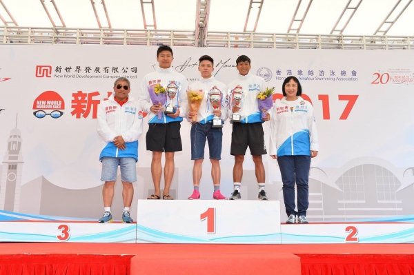 Keith Sin (centre) is crowned champion of the New World Harbour Race.