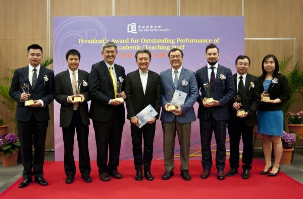 Professor Roland Chin (fourth from left) congratulates the winners of the President's Award for Outstanding Performance (from left) Professor Xu Jianliang, Dr Zhang Hongjie, Dr Kevin Yue, Dr Tu Feng, Dr Krzysztof Sliwinski, Dr Gary Wong and Dr Celine Song