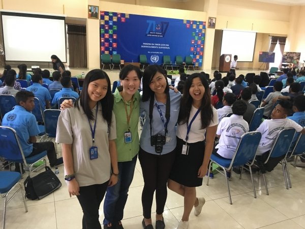 Joanna Wong (left) and three other United Nations volunteers from Hong Kong help organise the United Nations Day in Timor-Leste.