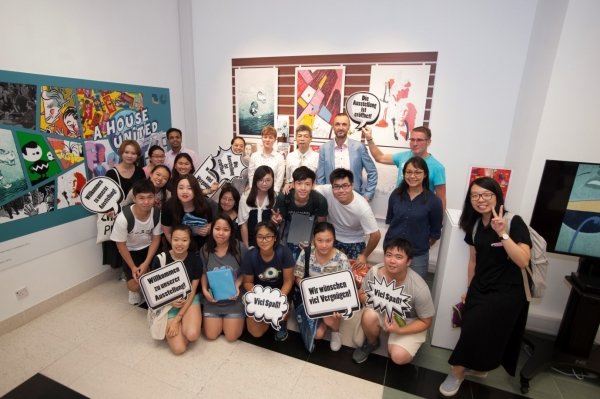 Guests and students share the joy of reading comics at the opening ceremony