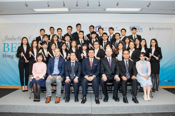 Dr William Leung (centre, front row), outstanding graduates, students and faculty members of the School of Business receive recognition at the eighth Induction Ceremony of Beta Gamma Sigma HKBU Chapter