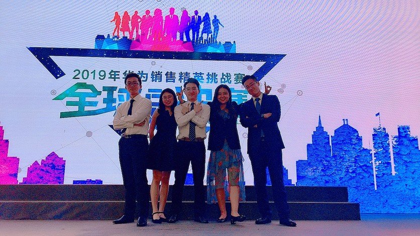 John Xu (right) receives the Best Planner award.