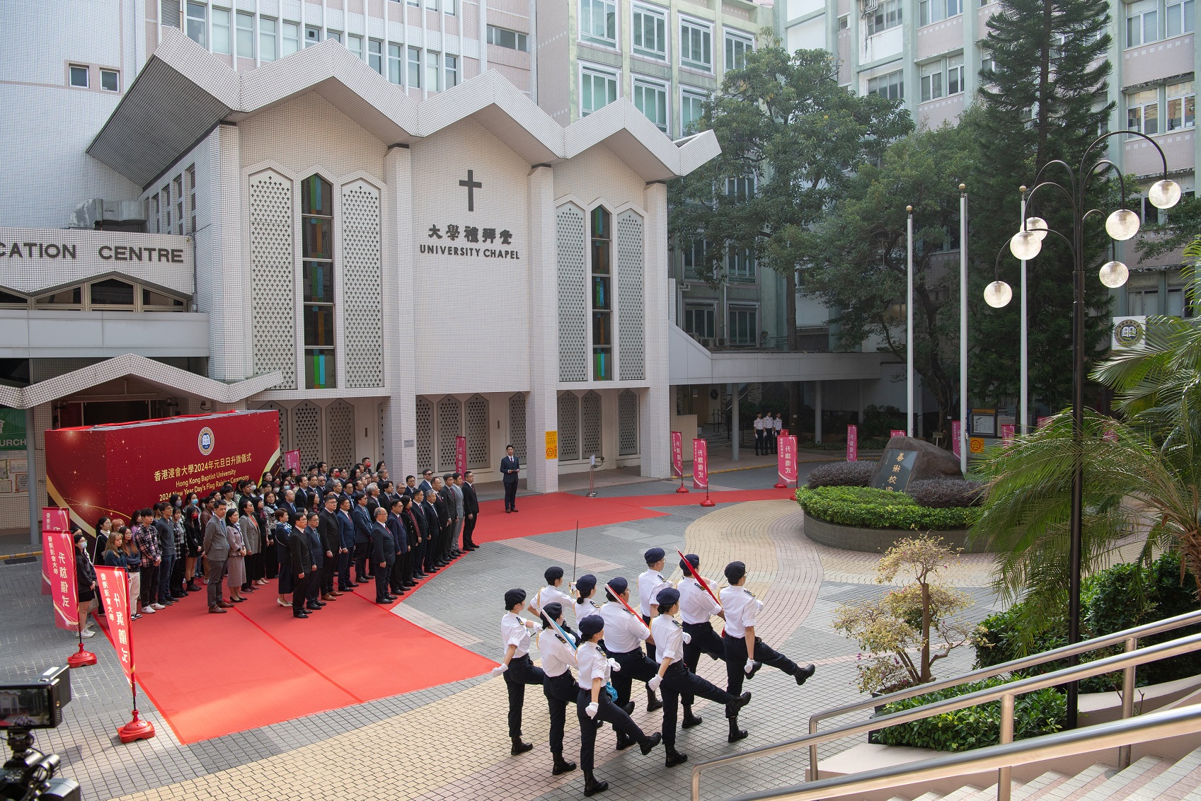 The HKBU student team performs the solemn duty of flag-raising.